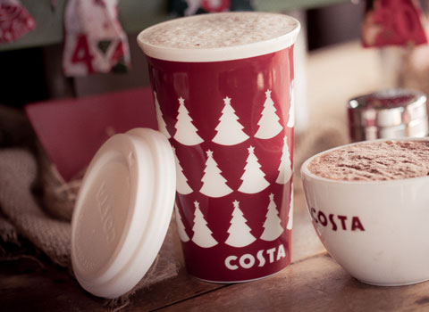 Costa mug of cappucino and a Christmas Costa cup with lid